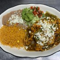 Pollo Con Nopalitos · Delicious chicken breast cooked with green tomatillo sauce with cactus leaves.