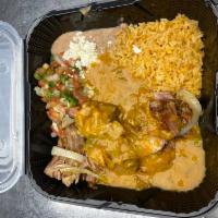 Carnitas Plate · Tender chunks of pork, smothered with green chili, served with guacamole, fried onions, and ...
