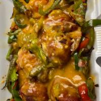 Camarones Fiesta · 6 wrapped shrimp with bacon, stuffed with cheese. Served over a bed of sauteed bell pepper, ...