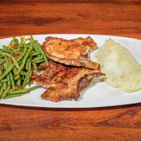 Bacon’s Pork Chops Plate · Two perfectly seasoned thin, center cut pork chops. Served with mashed potatoes, choice of v...