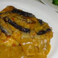 Veal Portobello · Sauteed with portobello mushrooms, caramelized onions, Madeira wine and cream. Served with p...