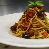 Spaghettini Alla Puttanesca · Anchovies, gaeta olives, capers and pepper flakes sauteed with garlic, plum tomatoes and bas...