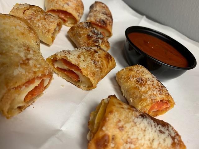 Ziggy Bites · Our homemade pizza dough stuffed with cheese and pepperoni, served with warm marinara sauce.