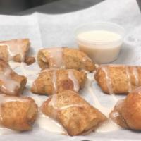 Cinna-bites · Our homemade dough, lightly spread cream cheese, sprinkled with cinnamon and sugar and baked...