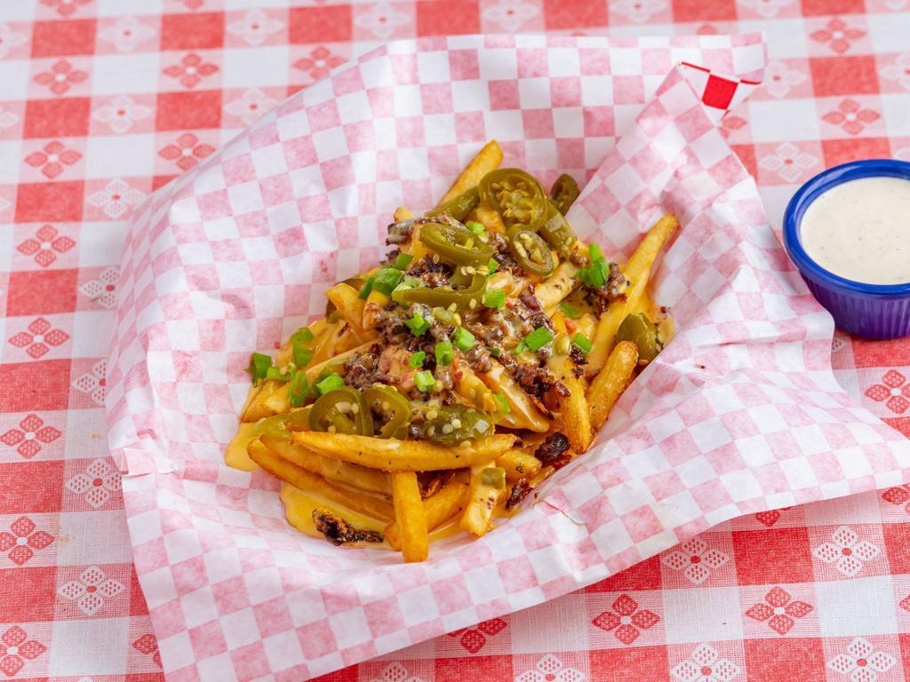 Loaded Fries · Covered in queso and bacon bits green onion and jalapeno 