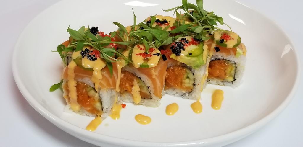In And Out Salmon Roll · Salmon, avocado on spicy salmon roll with jalapeno, tobiko and cilantro.
