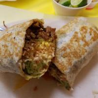 Pastor Burrito · Servido con frijoles, lechuga, tomate, aguacate, queso y crema. Served with beans, lettuce, ...