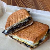 The Garden Panini · Roasted peppers, grilled onions, grilled zucchini, roasted portobello mushrooms, Swiss chees...