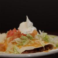 1 Burrito · A flour tortilla stuffed with your choice of shredded beef, seasoned beef, shredded chicken,...