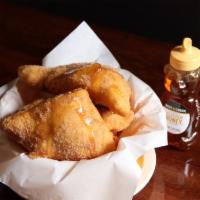 4 Sopapillas · Mexican pastries coated in cinnamon-sugar. Served with honey for dipping or filling.