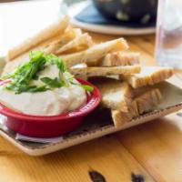Whipped Ricotta Dip · Scallions and truffle oil.  Served with homemade focaccia.
