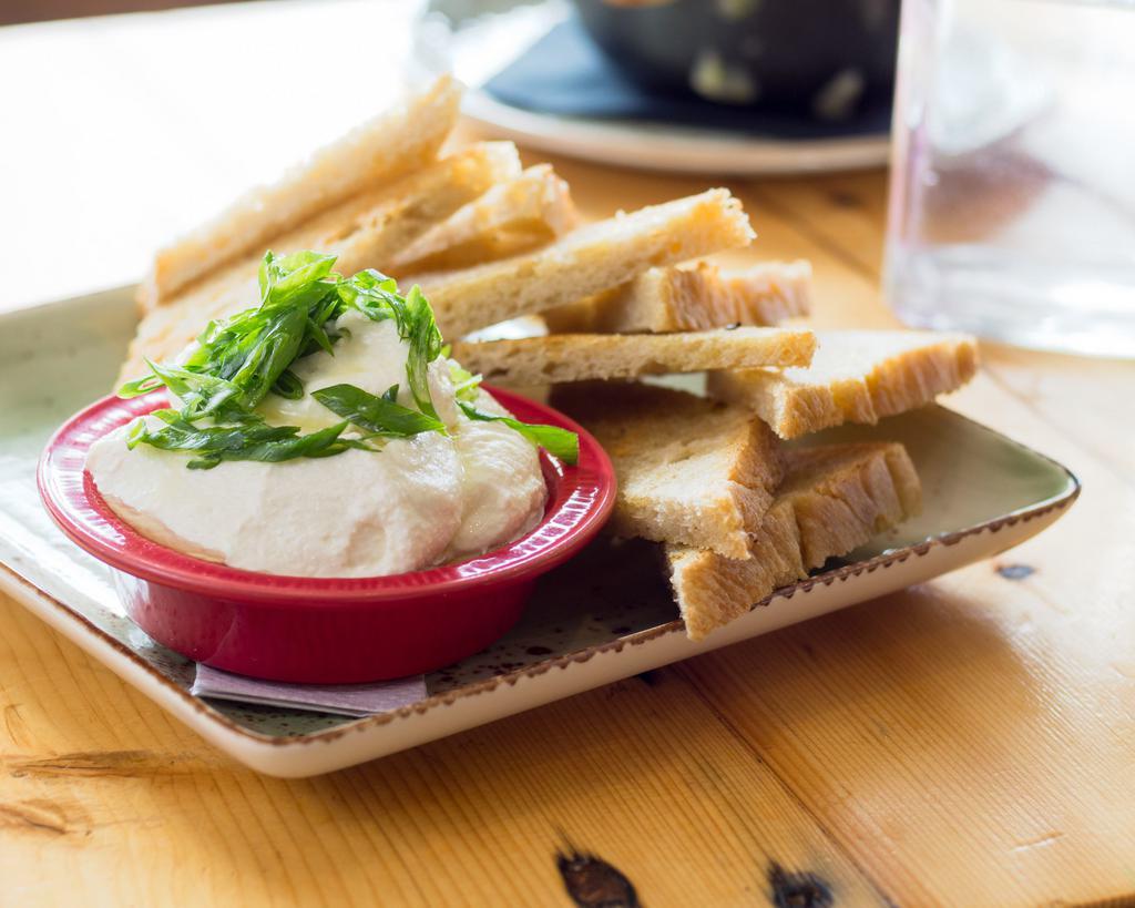 Whipped Ricotta Dip · Scallions and truffle oil.  Served with homemade focaccia.