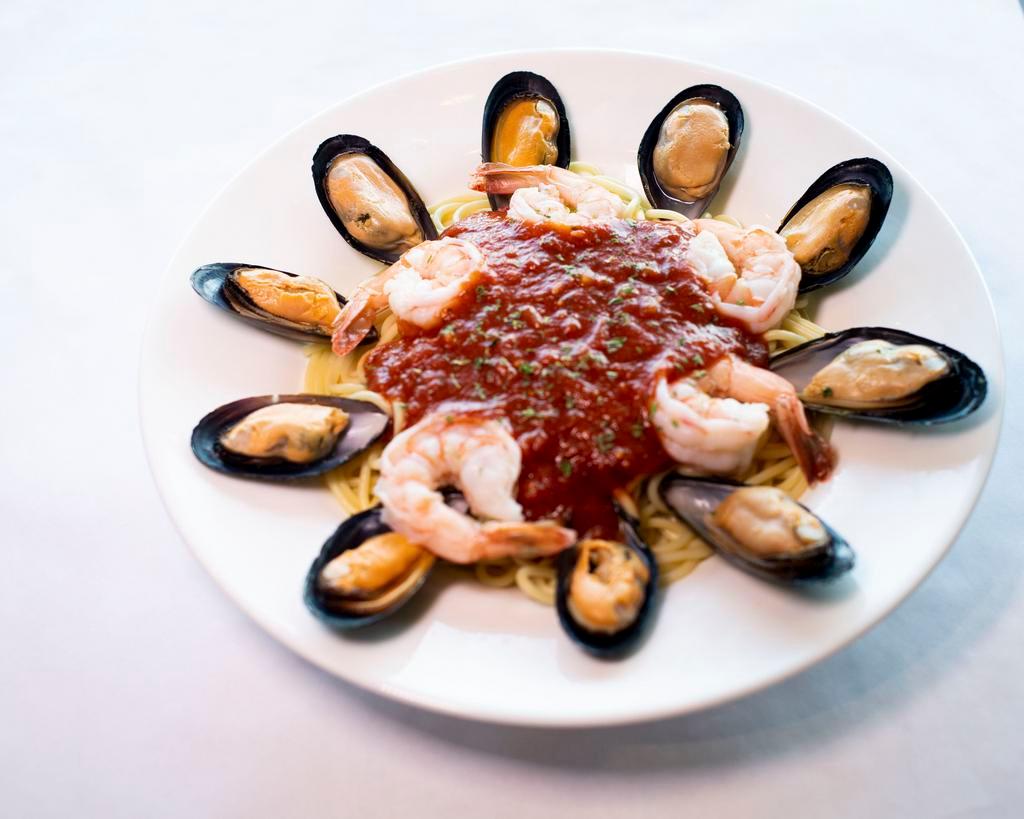 Spaghetti Marinara with Shrimp and Mussels · Fresh shrimp, mussels, and marinara tossed with garlic, spaghetti, and Parmesan.