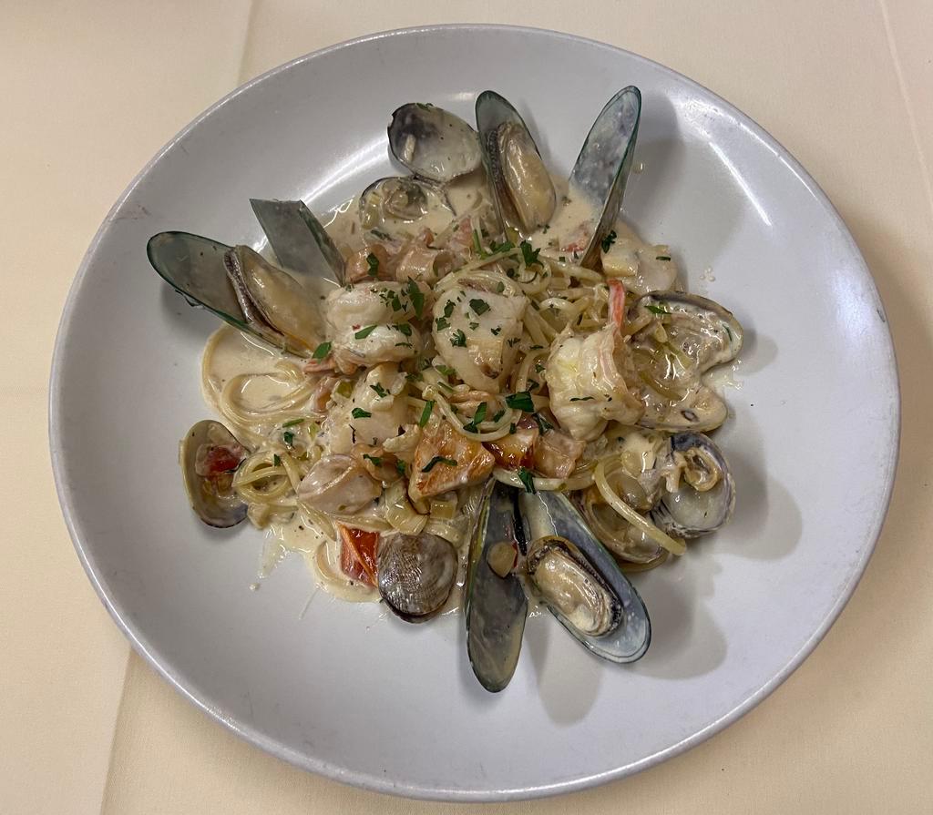 Pasta di Mare · Calamari, shrimp,scallops, mussels and clams.
