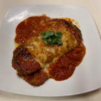 Melanzane Alla Vaness · Layered eggplant, mozzarella, Parmesan and tomato sauce. Fresh hot home-made bread.
