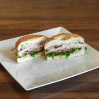 Turkey Bagel · Smoked turkey with provolone cheese, tomato, red onion, forest greens, and sun-dried tomato ...