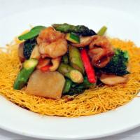 Shanghai Pan Fried Noodles · Topped with beef, chicken, shrimp and vegetables.