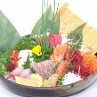 Sashimi Deluxe · 21 pieces of assorted sliced fish served raw. Served with soup and salad.
