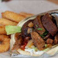 Gyros Sandwich · Precombined beef and lamb slowly flame broiled with Eastern spices, wrapped in a pita with i...