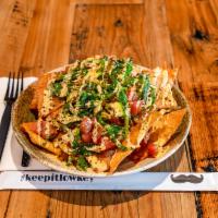 Poke Nachos · Wonton chips with our fresh yellow fin tuna with white and green onion , your choice of spic...
