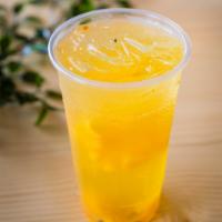 Passion Fruit & Mango Tea 百香芒果 · Passion fruit and mango green tea served with fresh mango slices and passion fruit.