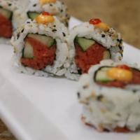 Spicy Tuna Roll · Nori (dried seaweed), sushi rice, sesame seed, spicy tuna, and cucumber. Topped with spicy m...