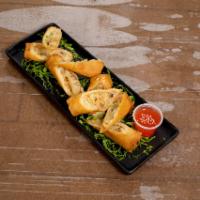 A2. 4 Piece Thai Spring Rolls · Mixed of cabbage, carrots, garlic, pepper, onions and mushrooms. Deep fried and served with ...