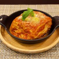 Lasagna Bolognese · Layers of ground beef,  onion, celery, carrot,