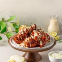 Snowed Garlic Spicy Chicken · Sweet and spicy chicken with Snow Onion Sauce Drizzled on top to add Rich Creamy Savory Flav...