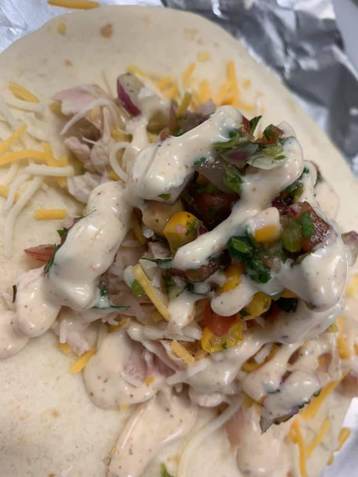 Chicken Fiesta Tacos · 2 Tacos- pulled chicken, shredded cheese, corn jalapeno salsa and topped with White Alabama BBQ sauce on flour tortillas. Served with nacho chips, salsa or queso and a drink. 