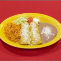 Enchiladas Suizas · 2 chicken enchiladas covered with tomatillo sauce and topped with queso fresco. Garnished wi...