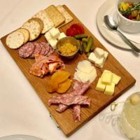 Cheese & Charcuterie  · Assorted cheeses and cured meats with crackers, dried fruits and apricot mostarda.