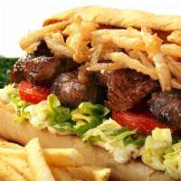 Bistro Steak Sandwich · (1057 cals.) Grilled steak sliced topped with fried onion straws, bistro sauce, lettuce and ...