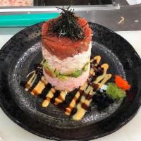 Ahi tower · rice.avo.crabmeat.spicy tuna. 3 kinds tobiko.kizami nori with eel sauce.spicy mayo.wasabi
