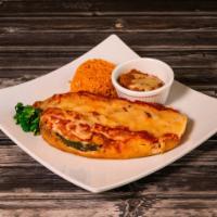 Chiles Rellenos Plate · Grilled California green chilies stuffed with cheese and salsa ranchera.