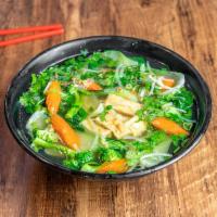 V3. Tofu Rice Noodle Soup · Pho dau hu chay. Served with steamed bok choy, broccoli, and carrot.