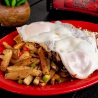 Huevos Rancheros · 2 eggs topped with green salsa served with refried beans, queso fresco and breakfast potatoes.