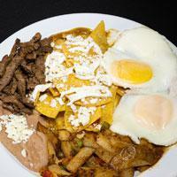 Chilaquiles Especial · Fresh tortilla chips simmered with green salsa, served with refried beans, and breakfast pot...
