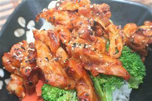 Spicy Chicken Plate · Juicy marinated spicy chicken breast on rice & veggies. Topped with teriyaki sauce and sesam...