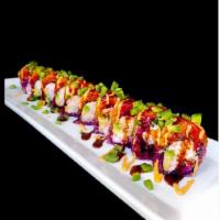 Dynamite Roll · Crab salad, avocado, cucumber topped with spicy tuna, sriracha sauce, spicy mayo, eel sauce,...