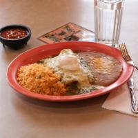 Suiza Enchilada · 2 Corn Tortillas stuffed with your choice of: shredded beef, ground beef,
shredded chicken o...