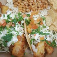 2 Piece Fish Taco Combo · Comes with Rice & Beans or Rice and salad or Fries or Rice and salad.