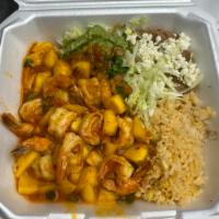 Camarones al Mango · Delicious shrimp cooked with our special recipe with fresh mango. Served with rice, beans, g...