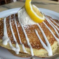 Roy’s Ricotta Pancakes · 2 ricotta pancakes, lemon creme fraiche, powdered sugar and housemade whipped cream.