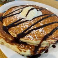 Chocolate Chip Pancakes · 2 pancakes with chocolate chips, chocolate sauce, powdered sugar and housemade whipped cream.