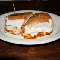 Chicken Parmigiana Sandwich · Melted mozzarella and marinara sauce.