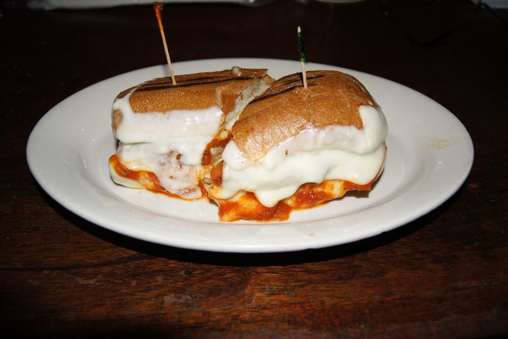 Chicken Parmigiana Sandwich · Melted mozzarella and marinara sauce.