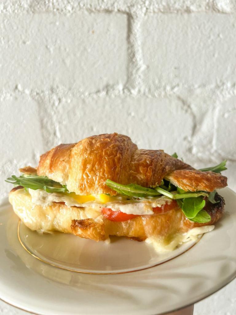 veggie breakfast sandwich · roasted red pepper, arugula, white cheddar and an egg on a croissant.