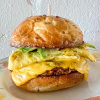 meat breakfast sandwich · chorizo, avocado, american cheese and an egg on an onion roll.  