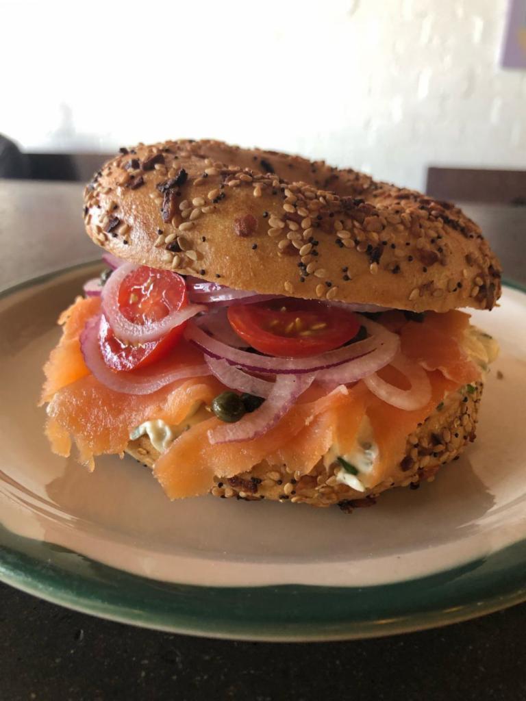 bagel & lox · everything bagel, herbed cream cheese, lox, red onion, cherry tomatoes and capers